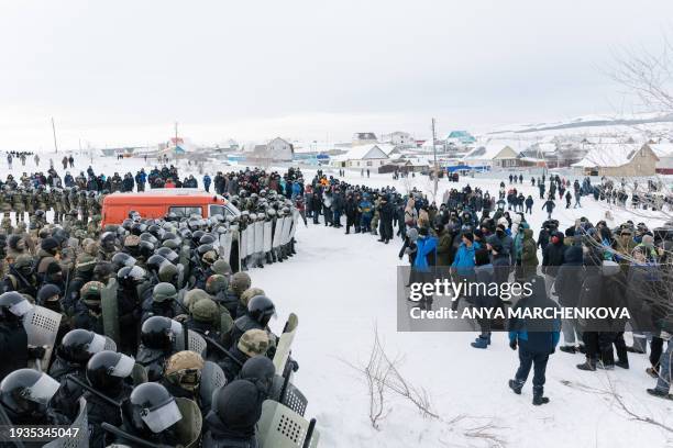 Riot policemen disperse protesters in the town of Baymak in Russia's central Bashkortostan region on January 17 after a court sentenced a local...