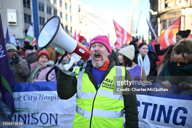 Thousands of public service workers take part in a mass rally during their strike outside Belfast City Hall on January 18, 2024 in Belfast, Northern...