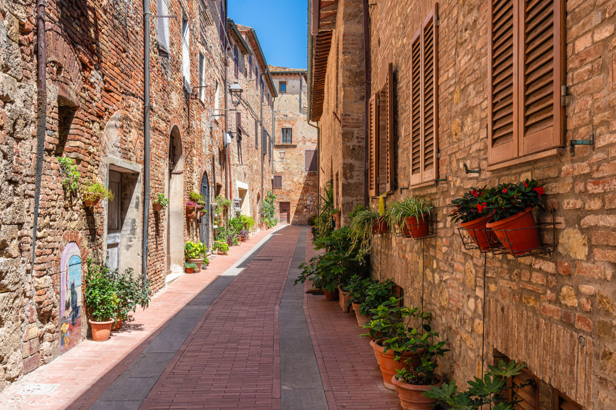 The picturesque village of Casole d'Elsa on a sunny summer morning. Province of Siena, Tuscany, Italy The picturesque village of Casole d'Elsa on a sunny summer morning. Province of Siena, Tuscany, Italy