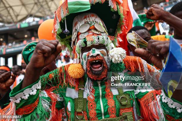 An Ivory Coast's supporter gestures ahead of the Africa Cup of Nations 2024 group A football match between Ivory Coast and Nigeria at the Alassane...