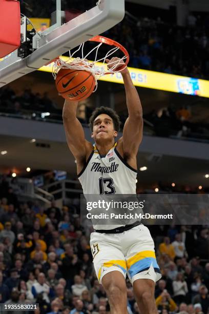 Oso Ighodaro of the Marquette Golden Eagles dunks the ball during the first half against the Villanova Wildcats at Fiserv Forum on January 15, 2024...