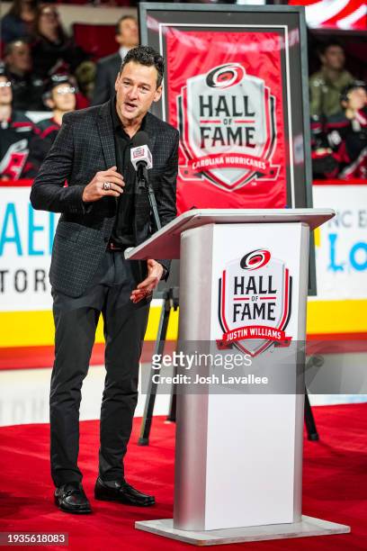 Justin Williams is inducted into the Carolina Hurricanes hall of fame prior to a game against the Los Angeles Kings at PNC Arena on January 15, 2024...