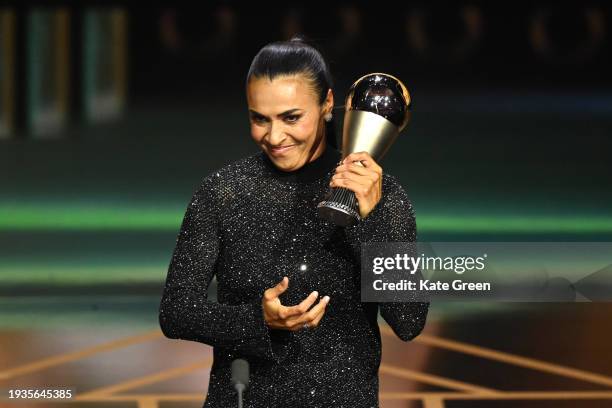 Marta Vieira da Silva reacts with the trophy during a Special Presentation during the The Best FIFA Football Awards 2023 at The Apollo Theatre on...