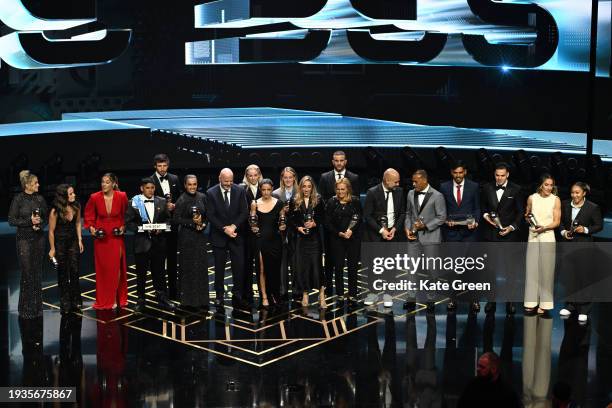 President, Gianni Infantino stands alongside Lauren James, Aitana Bonmati, Keira Walsh, Ella Toone, Alessia Russo, Lucy Bronze, Alex Greenwood, Olga...