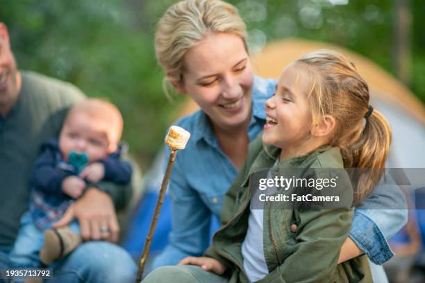roasting marshmallows with mom - marshmallow stock pictures, royalty-free photos & images