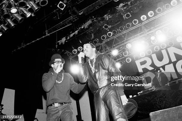 The members of American Hip Hop group Run-DMC perform onstage at Eastside High School, Paterson, New Jersey, February 11, 1988. Pictured are, from...