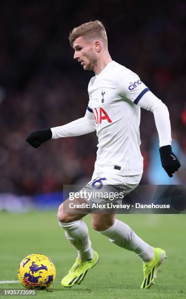 Timo Werner of Tottenham Hotspur runs with the ball during the Premier League match between Manchester United and Tottenham Hotspur at Old Trafford...