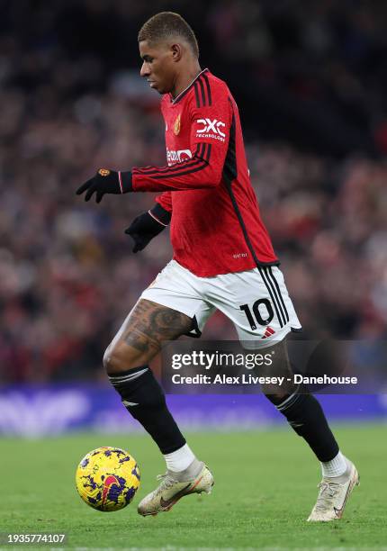 Marcus Rashford of Manchester United runs with the ball during the Premier League match between Manchester United and Tottenham Hotspur at Old...