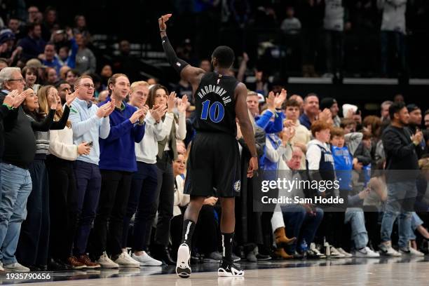 Tim Hardaway Jr. #10 of the Dallas Mavericks gestures to the crowd as he walks up the court during the second half against the New Orleans Pelicans...