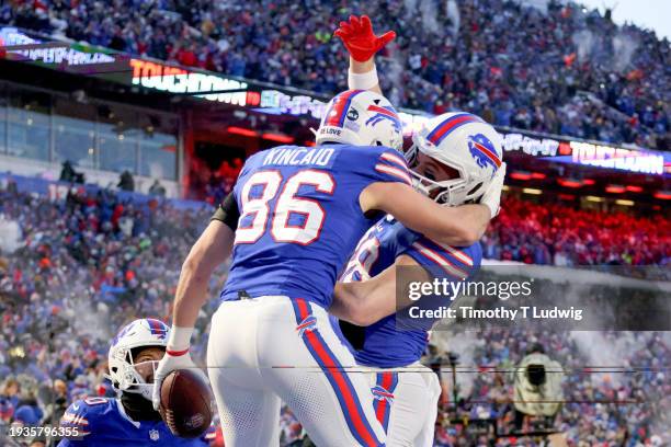 Dalton Kincaid of the Buffalo Bills celebrates his touchdown against the Pittsburgh Steelers during the first quarter at Highmark Stadium on January...