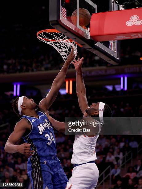 Precious Achiuwa of the New York Knicks heads for the net as Wendell Carter Jr. #34 of the Orlando Magic defends at Madison Square Garden on January...