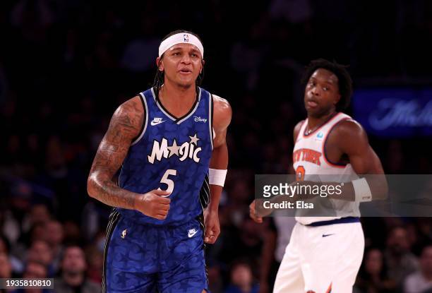 Paolo Banchero of the Orlando Magic celebrates his three point shot as OG Anunoboy of the New York Knicks looks on at Madison Square Garden on...