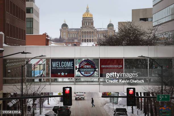 Pedestrian crosses a street in downtown as sub-freezing temperatures continue on January 15, 2024 in Des Moines, Iowa. Iowans vote today in the...