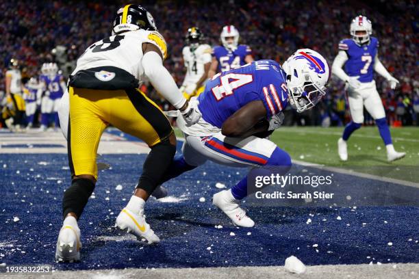 Kaiir Elam of the Buffalo Bills intercepts a pass intended for Diontae Johnson of the Pittsburgh Steelers in the end zone during the second quarter...