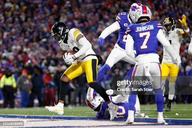 Diontae Johnson of the Pittsburgh Steelers catches a touchdown pass against Dane Jackson of the Buffalo Bills during the second quarter at Highmark...