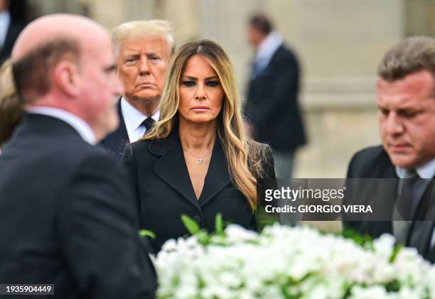 Former US First Lady Melania Trump , with her husband former US President Donald Trump , leaves the funeral service for her mother, Amalija Knavs, at...