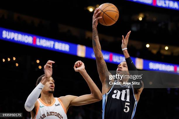 Dejounte Murray of the Atlanta Hawks shoots over Victor Wembanyama of the San Antonio Spurs during the first half at State Farm Arena on January 15,...