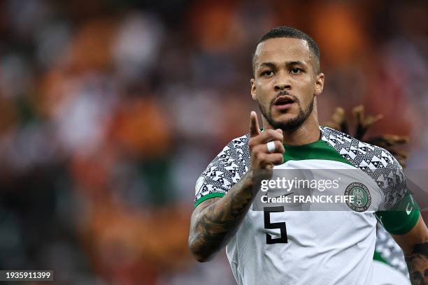 Nigeria's defender William Troost-Ekong celebrates after shooting a penalty and scoring his team's first goal during the Africa Cup of Nations 2024...