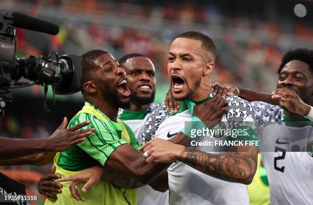 Nigeria's defender William Troost-Ekong celebrates after shooting a penalty and scoring his team's first goal during the Africa Cup of Nations 2024...