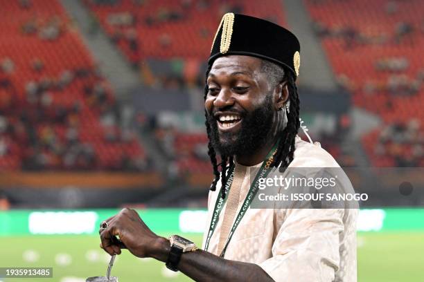 Former Togolese star footballer Emmanuel Adebayor looks on ahead of the Africa Cup of Nations 2024 group B football match between Egypt and Ghana at...