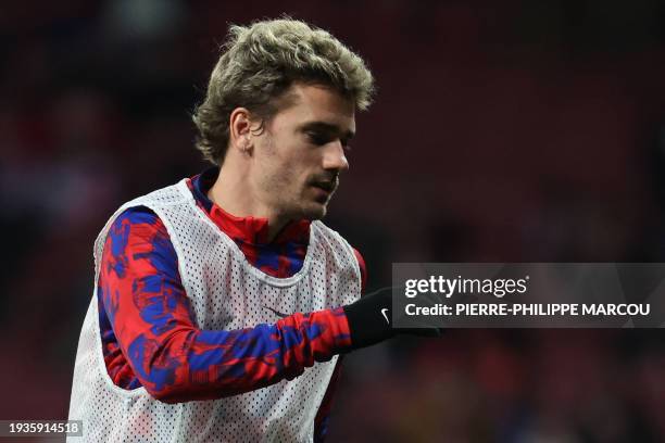 Atletico Madrid's French forward Antoine Griezmann warms up before the Spanish Copa del Rey football match between Club Atletico de Madrid and Real...
