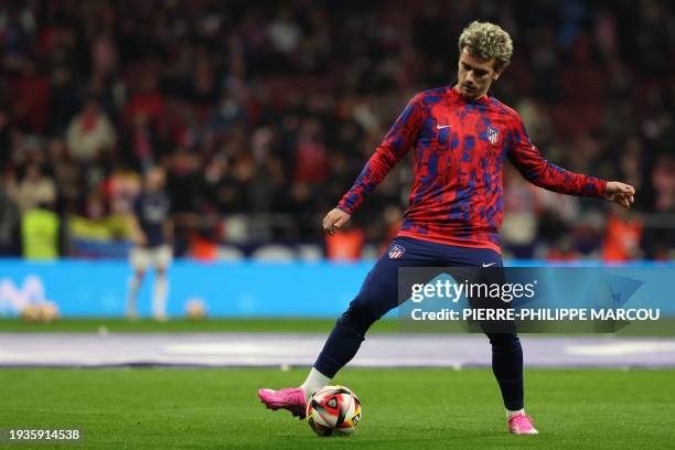 Atletico Madrid's French forward Antoine Griezmann warms up before the Spanish Copa del Rey football match between Club Atletico de Madrid and Real...