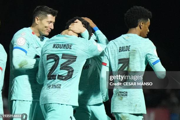 Barcelona's French defender Jules Kounde celebrates scoring his team's second goal with teammates during the Spanish Copa del Rey football match...
