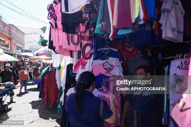 Man sells jerseys of the Argentine player Lionel Messi of Miami FC in a stand at the historic center market ahead of tomorrow's friendly match...