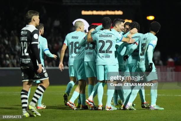 Barcelona's French defender Jules Kounde celebrates scoring his team's second goal with teammates during the Spanish Copa del Rey football match...