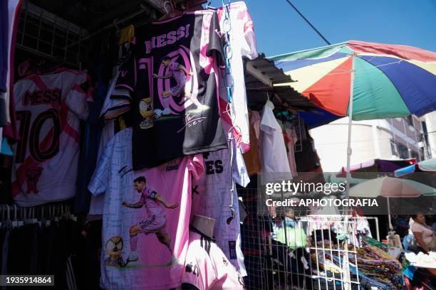 Jerseys of Argentine player Lionel Messi of Miami FC are displayed in a stand at the historic center market ahead of tomorrow's friendly match...