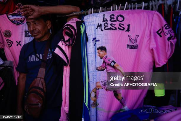 Man sells jerseys of Argentine player Lionel Messi of Miami FC in the historic center market ahead of tomorrow's friendly match between El Salvador...