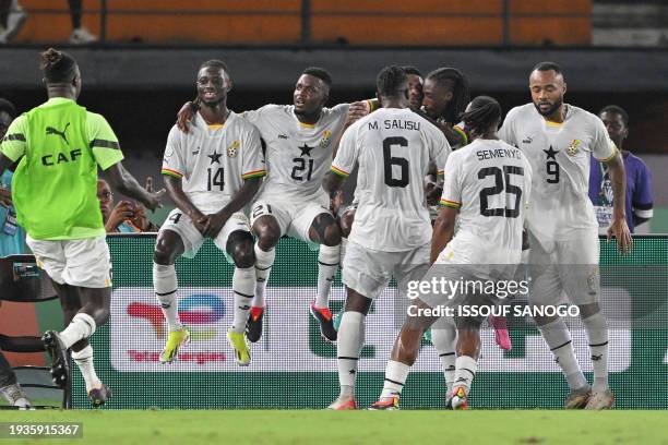 Ghana players celebrate after Ghana's midfielder Mohamed Kudus scored their team's first goal during the Africa Cup of Nations 2024 group B football...