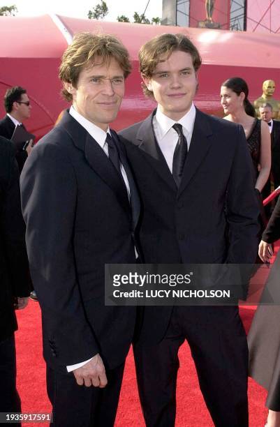 Actor Willem Dafoe poses with his son Jack as they arrive at the Shrine Auditorium during the 73rd Academy Awards in Los Angeles, California, 25...