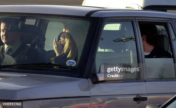 Actress Jennifer Aniston and husband Brad Pitt are driven away after their arrival at Kinloss RAF base in Scotland for the wedding of popstar Madonna...