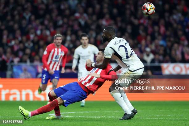 Real Madrid's German defender Antonio Rudiger holds Atletico Madrid's Spanish forward Alvaro Morata during the Spanish Copa del Rey football match...