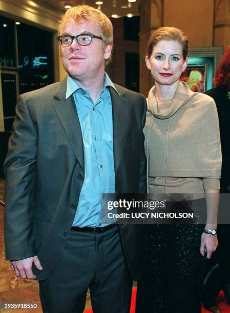 Actor Philip Seymour Hoffman arrives at the premiere of his new film "The Talented Mr Ripley" with his wife Jaysa , in Los Angeles, 12 December 1999....