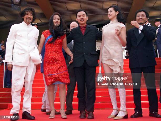 Chinese actor Tony Leung , actress Lu Li Ping , director Yu Lik Wai , actress Wong Ning and actor Rolf Chow pose on the steps of the Palais des...