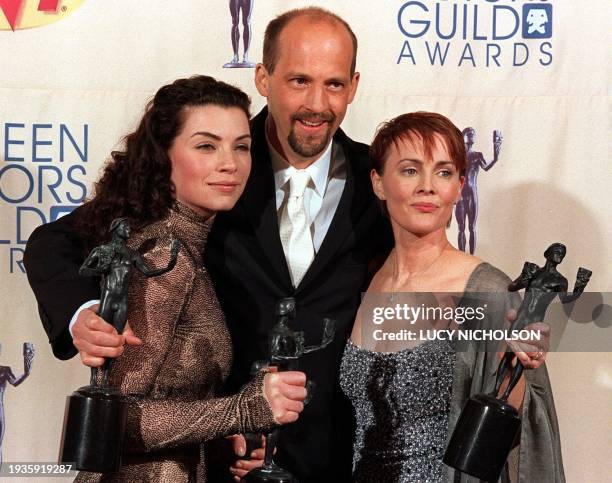 The cast of US Drama Series "ER", Julianna Margulies, Anthony Edwards and Laura Innes, pose with their awards for 'Outstanding Performance by a Drama...