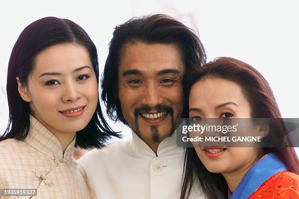 Chinese actors Wong Ning , Tony Leung and Lu Li Ping pose for photographers during the photocall of Chinese director Yu Lik Wai's film "Love Will...