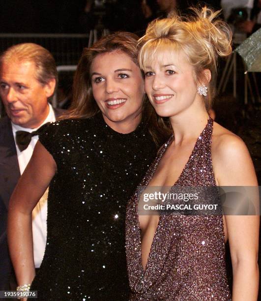 French TV stars Veronika Loubry and Cachou pose for photographers late 17 May upon arrival at the Palais des Festivals for the screening of "La Vita...