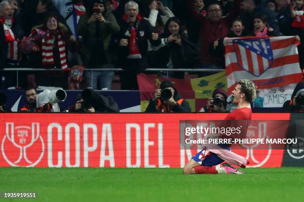 Atletico Madrid's French forward Antoine Griezmann celebrates scoring his team's third goal during the Spanish Copa del Rey football match between...