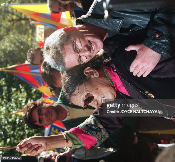 Actor Richard Gere embraces 67-year-old Adhe Tapontsang , a former prisoner of the Chinese government who is now living in exile, during a rally to...