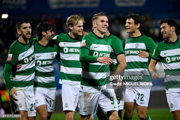 Sporting Lisbon's Swedish forward Viktor Gyokeres celebrates scoring his team's fifth goal with teammates during the Portuguese League football match...