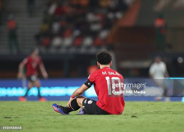 Mohamed Salah of Egypt sits on the floor with an injury during the TotalEnergies CAF Africa Cup of Nations group stage match between Egypt and Ghana...