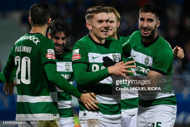 Sporting Lisbon's Swedish forward Viktor Gyokeres celebrates scoring his team's fifth goal with teammates during the Portuguese League football match...