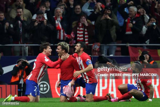 Atletico Madrid's French forward Antoine Griezmann celebrates scoring his team's third goal during the Spanish Copa del Rey football match between...