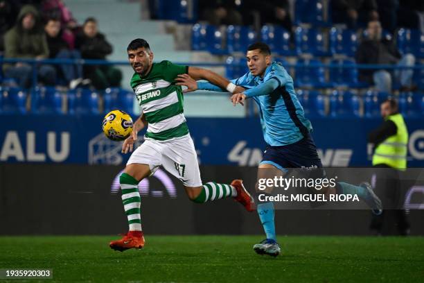 Sporting Lisbon's Portuguese defender Ricardo Esgaio fights for the ball with FC Vizela's Brazilian defender Matheus Pereira during the Portuguese...