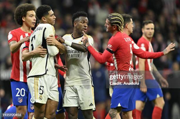 Jude Bellingham of Real Madrid argues with Rodrigo de Paul of Atletico Madrid during the Copa del Rey last 16 round football match between Atletico...