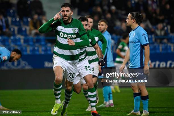 Sporting Lisbon's Portuguese forward Paulinho Dias Fernandes celebrates scoring his team's third goal during the Portuguese League football match...