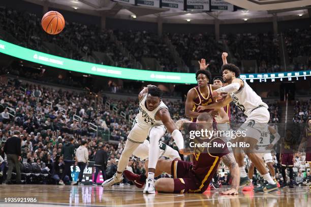 Jack Wilson of the Minnesota Golden Gophers and Mady Sissoko of the Michigan State Spartans battle for position during the second half of the game at...